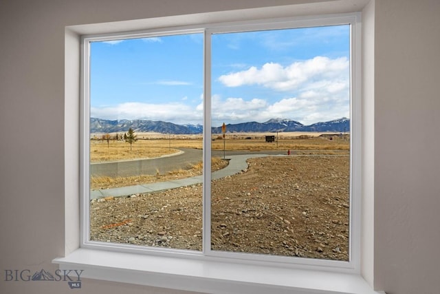 doorway to outside with a mountain view