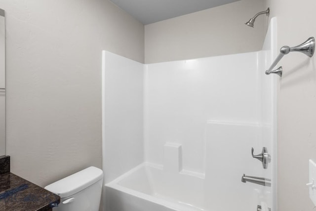 bathroom featuring shower / bathing tub combination, vanity, and toilet