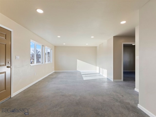 113 Washington St, Sheridan, MT 59749 - spare room featuring finished concrete flooring, baseboards, and recessed lighting