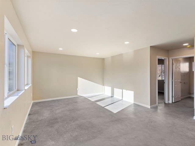 113 Washington St, Sheridan, MT 59749 - unfurnished room featuring concrete flooring, plenty of natural light, baseboards, and recessed lighting