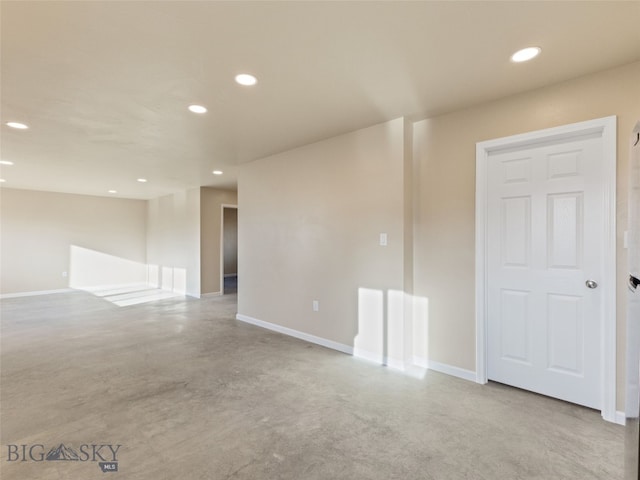 113 Washington St, Sheridan, MT 59749 - empty room with finished concrete floors, recessed lighting, and baseboards