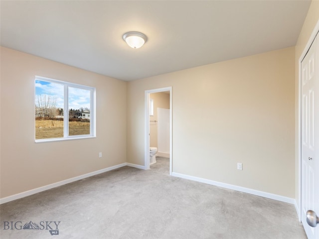 113 Washington St, Sheridan, MT 59749 - unfurnished bedroom with a closet, connected bathroom, and baseboards