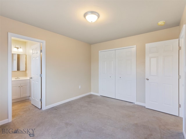 113 Washington St, Sheridan, MT 59749 - unfurnished bedroom featuring concrete flooring, a closet, a sink, and baseboards