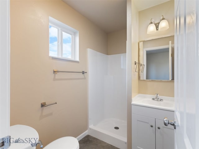 113 Washington St, Sheridan, MT 59749 - full bath featuring vanity, a shower stall, toilet, and baseboards