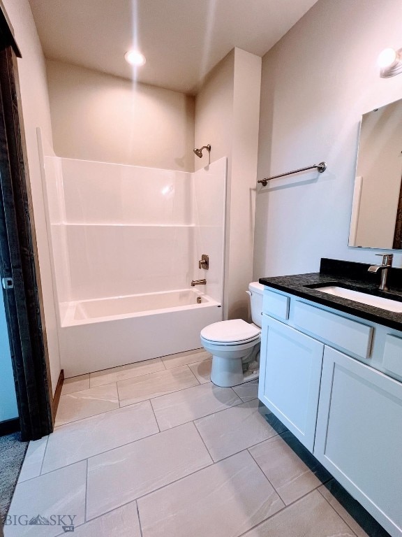 bathroom with  shower combination, vanity, and toilet