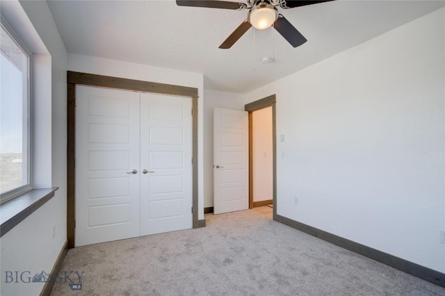 413 Garnier Ave Unit B, Livingston, MT 59047 - unfurnished bedroom with carpet floors, a closet, a ceiling fan, and baseboards
