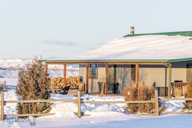 view of snow covered property