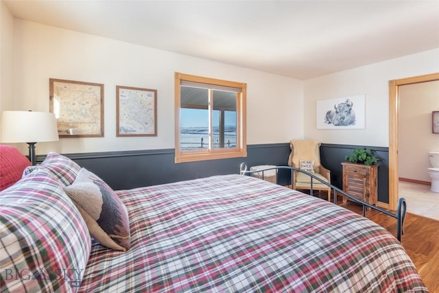 bedroom with wood finished floors