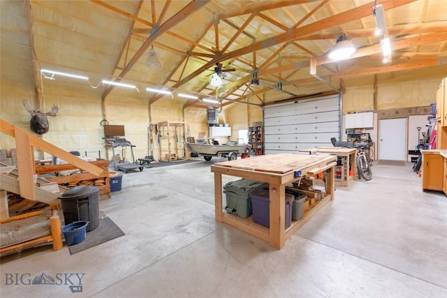 garage featuring a workshop area and a garage door opener
