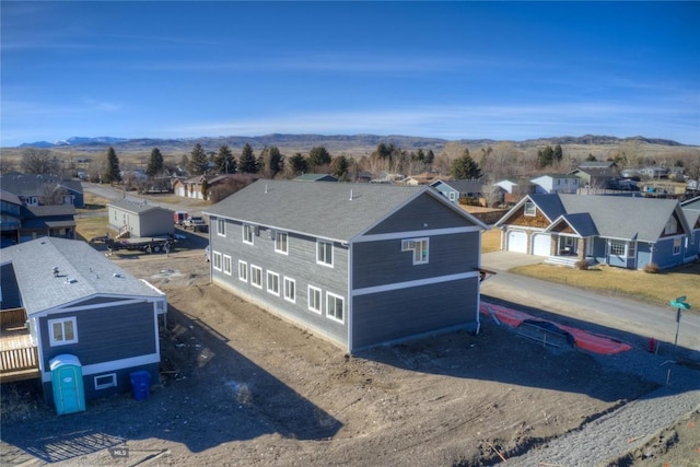 bird's eye view featuring a residential view and a mountain view