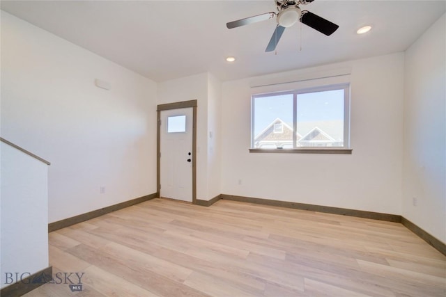 interior space with light wood-style floors, recessed lighting, ceiling fan, and baseboards