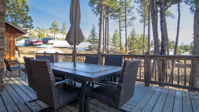 deck with outdoor dining area