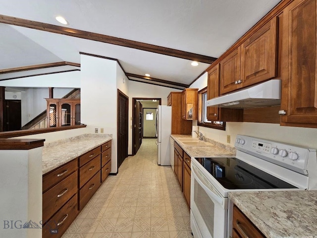 kitchen with vaulted ceiling with beams, under cabinet range hood, white appliances, a sink, and light floors