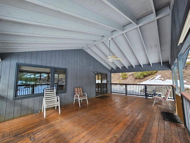 wooden terrace featuring ceiling fan