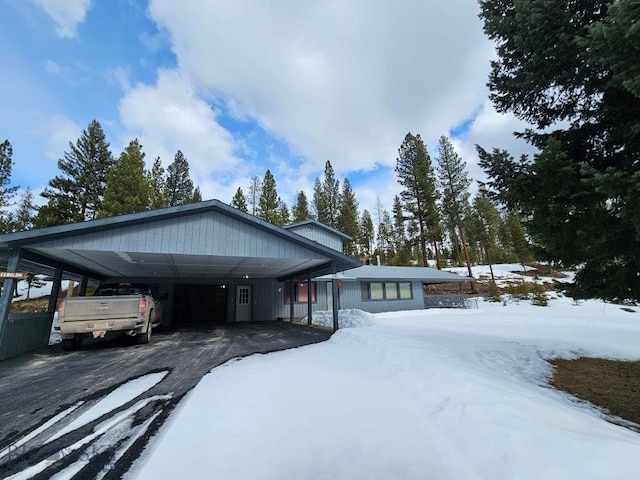 view of front of property with a carport and driveway