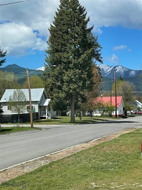 view of road with street lighting and a mountain view