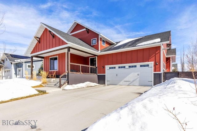 view of front of property featuring covered porch, a garage, a shingled roof, concrete driveway, and board and batten siding