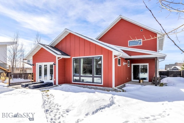 view of front of property featuring board and batten siding, french doors, and a deck