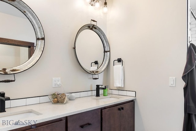 bathroom featuring double vanity and a sink