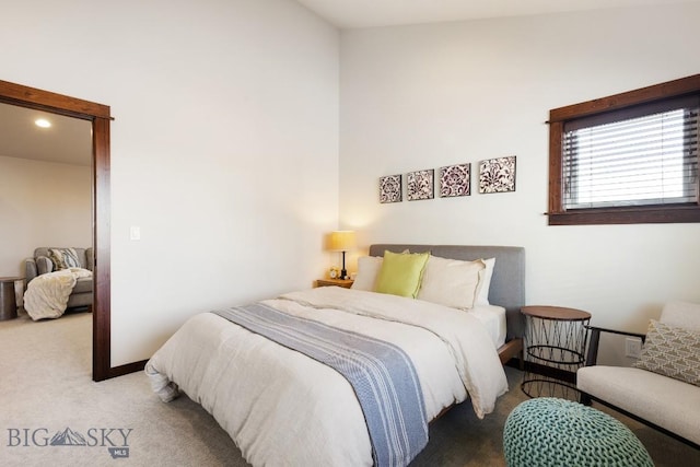 bedroom with carpet floors and baseboards