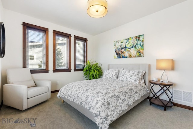 carpeted bedroom with baseboards and visible vents