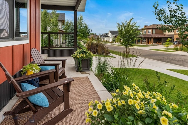 exterior space featuring a residential view and covered porch