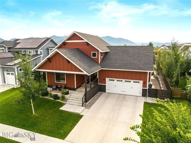 view of front of house with a garage, a shingled roof, concrete driveway, covered porch, and board and batten siding