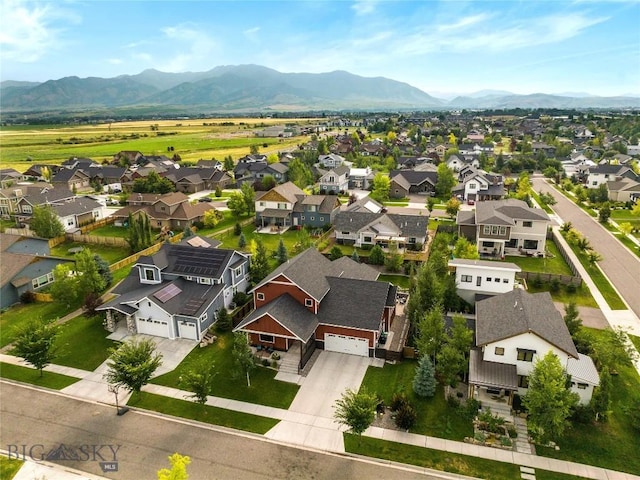 birds eye view of property with a residential view and a mountain view