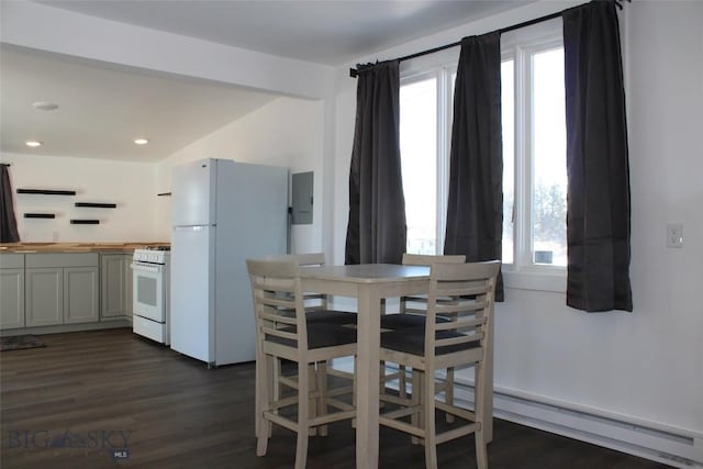 dining area featuring dark wood-style floors, recessed lighting, and plenty of natural light