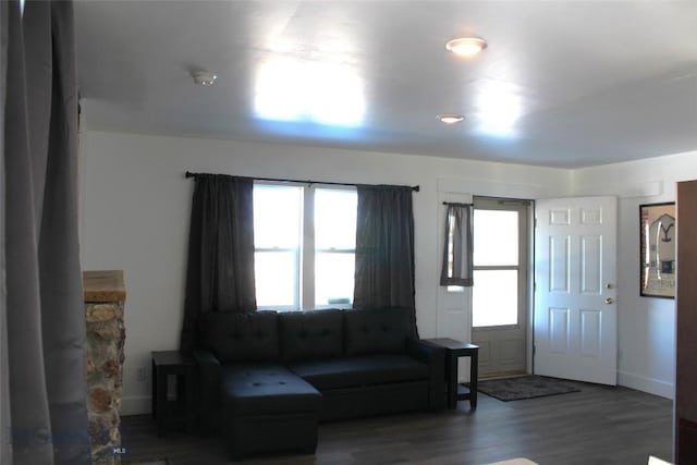 living room with wood finished floors and baseboards