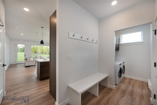 mudroom with recessed lighting, light wood-style flooring, baseboards, and independent washer and dryer