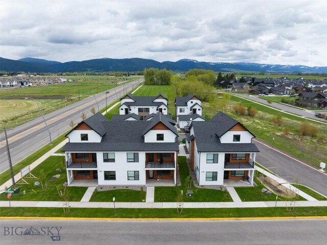 birds eye view of property with a mountain view