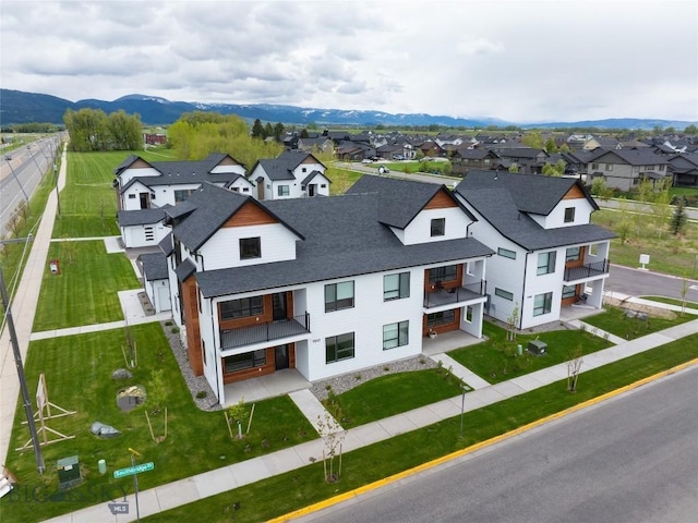 birds eye view of property with a residential view and a mountain view