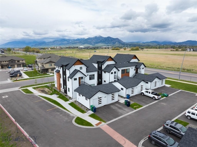 drone / aerial view with a residential view and a mountain view