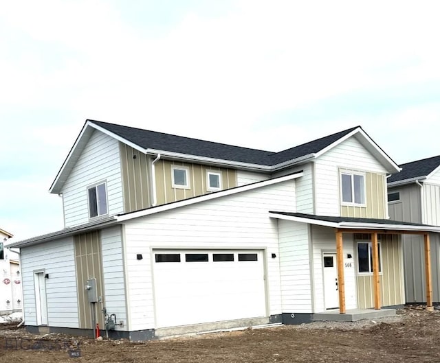 view of front of property featuring an attached garage and board and batten siding