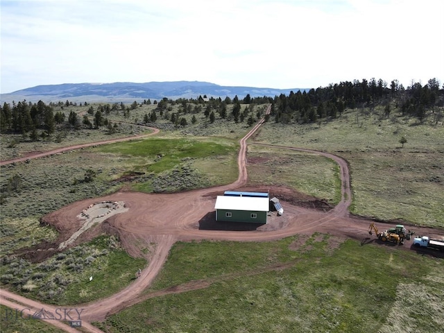 48 Black Butte Trl, White Sulphur Springs, MT 59645 - aerial view of property and surrounding area featuring rural landscape and a mountain backdrop