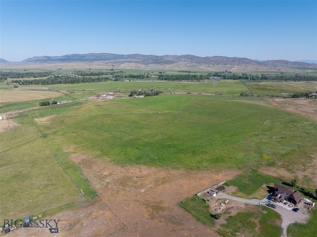 drone / aerial view featuring a rural view and a mountain view