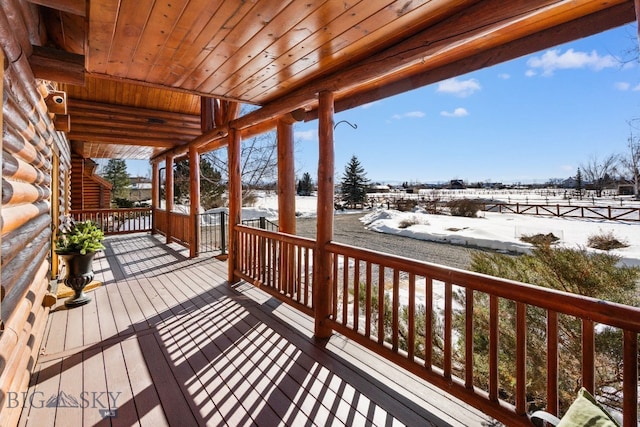 view of snow covered deck