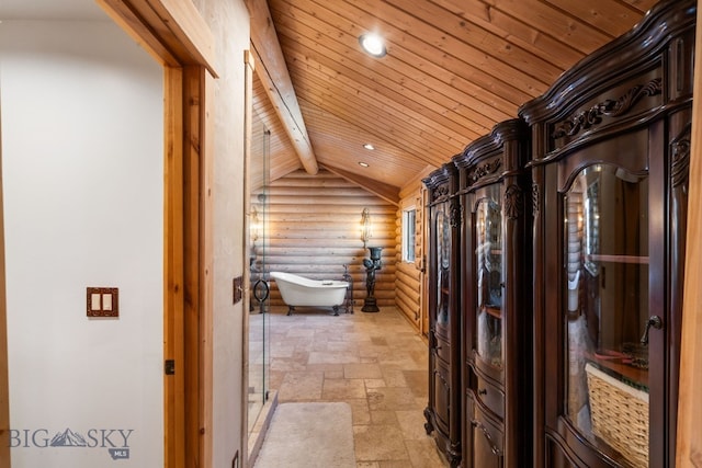 corridor featuring vaulted ceiling with beams, log walls, recessed lighting, stone tile flooring, and wood ceiling