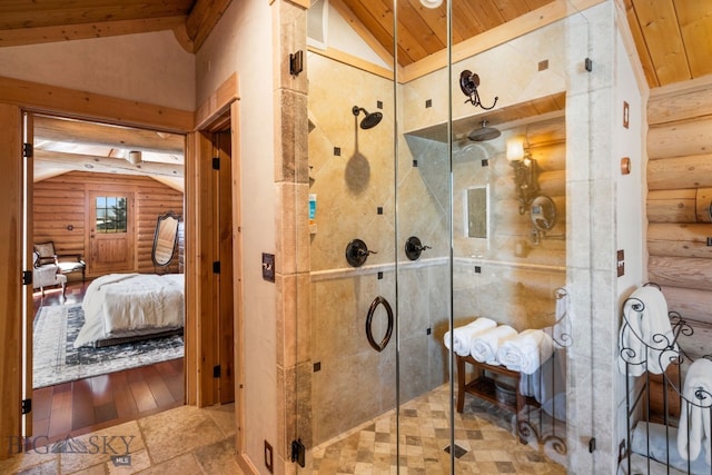 ensuite bathroom with stone tile floors, lofted ceiling, ensuite bathroom, a stall shower, and wooden ceiling