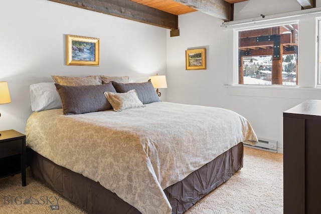 carpeted bedroom with beamed ceiling and baseboard heating