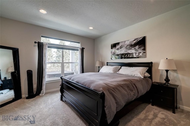 carpeted bedroom with recessed lighting, a textured ceiling, and baseboards