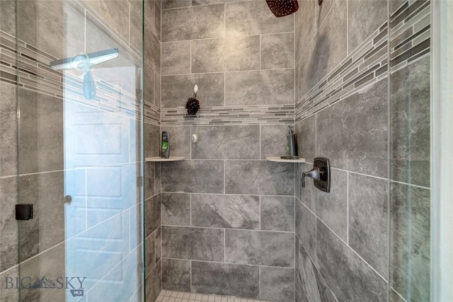 full bath featuring a shower stall