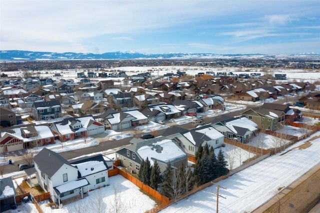 snowy aerial view with a residential view