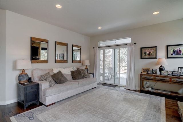 living room with dark wood finished floors, recessed lighting, and baseboards