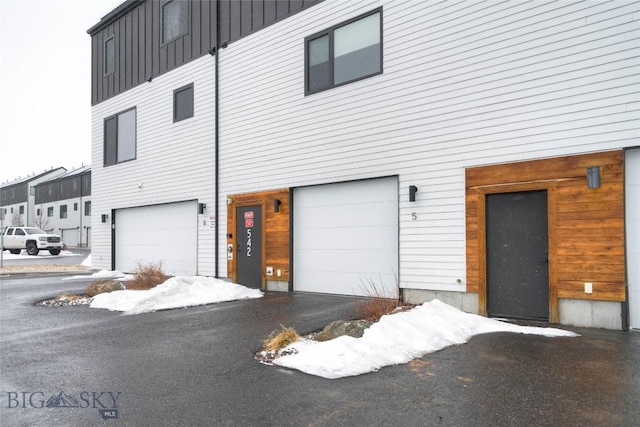 view of front of house featuring board and batten siding and a garage