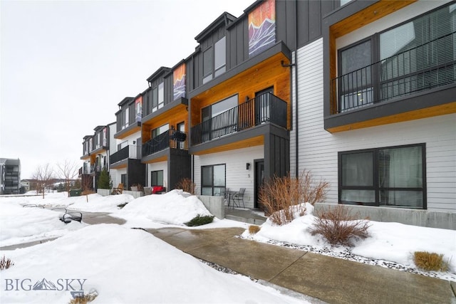 snow covered building with a residential view