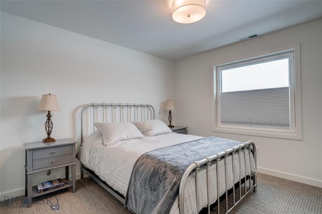 bedroom featuring carpet, visible vents, and baseboards