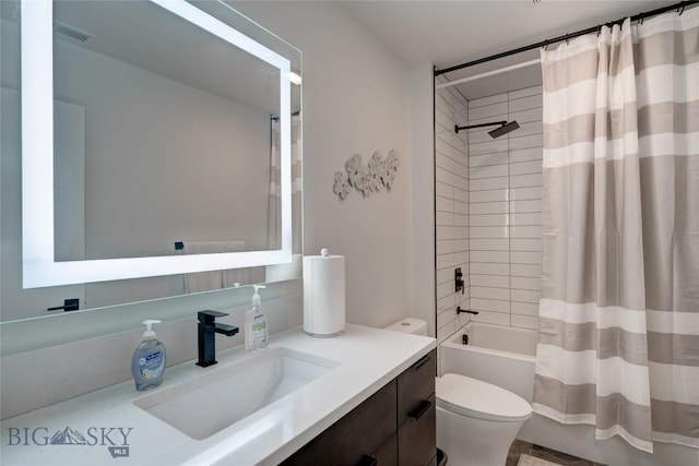 full bathroom featuring vanity, shower / bath combination with curtain, toilet, and visible vents