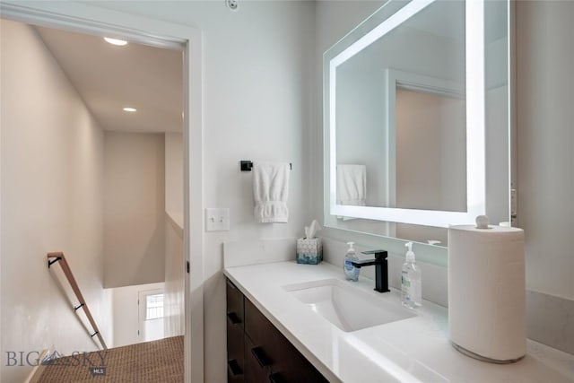 bathroom with recessed lighting and vanity